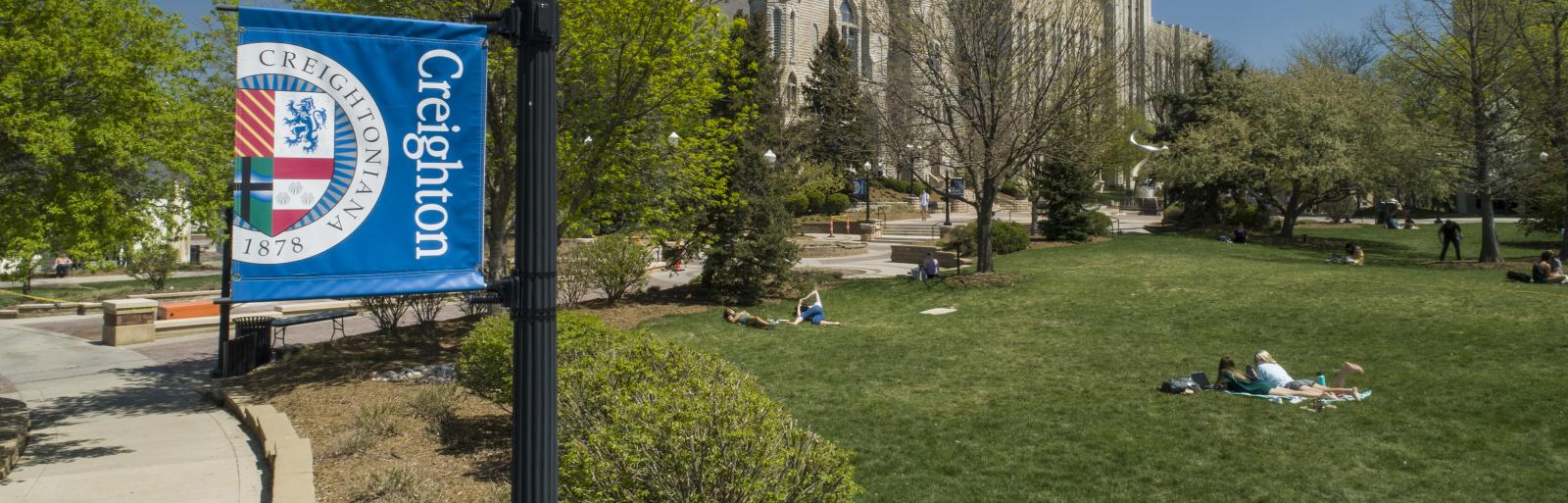 Creighton campus with students on the lawn
